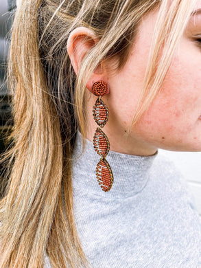 Beaded Football Dangle Earrings